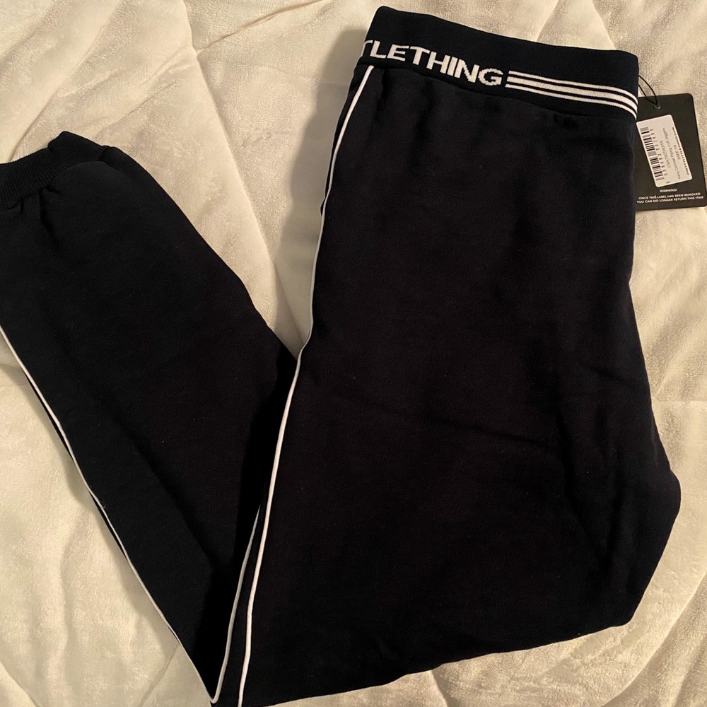 SIZE 10, black sweatpants from Pretty Little Thing.